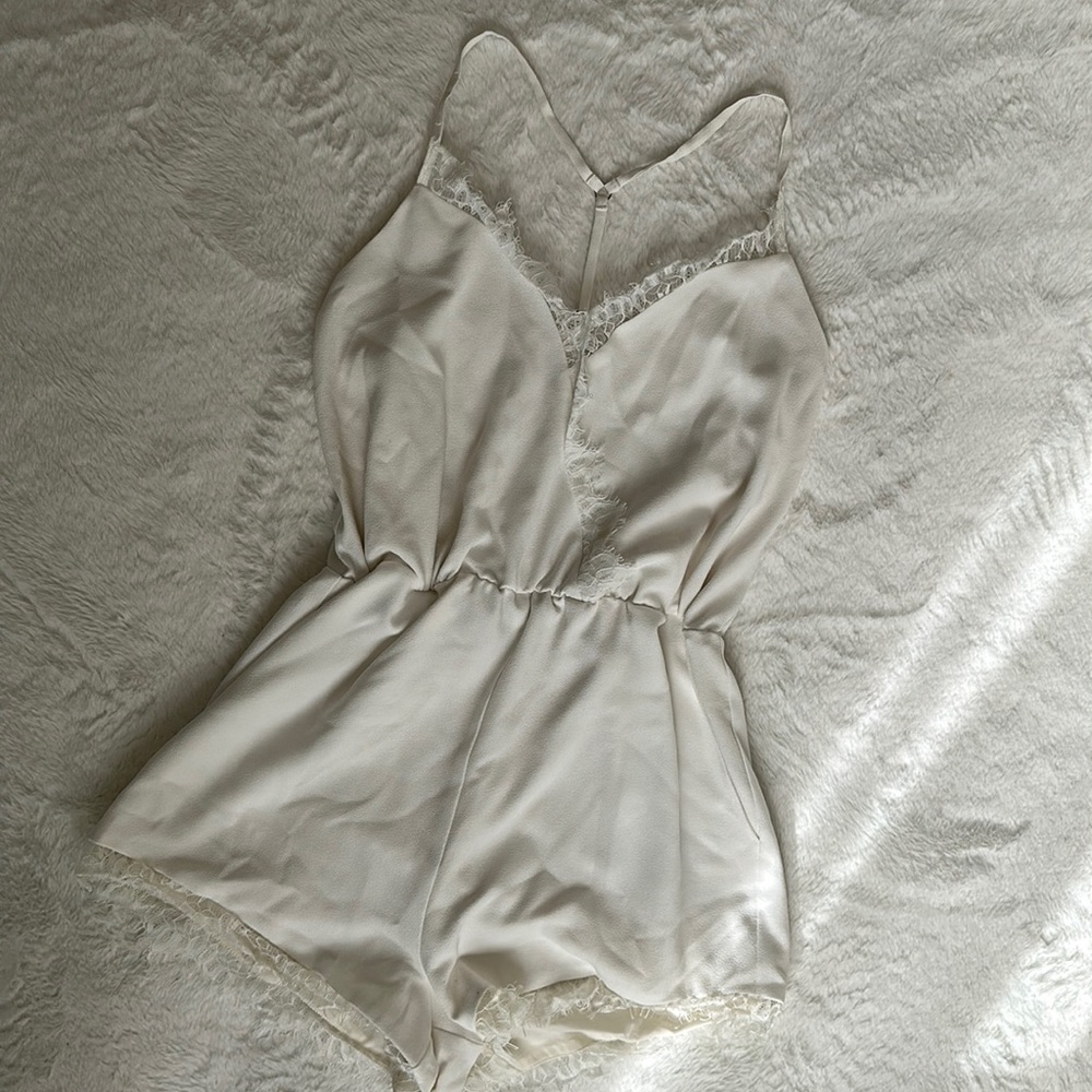 Kittenish white romper
